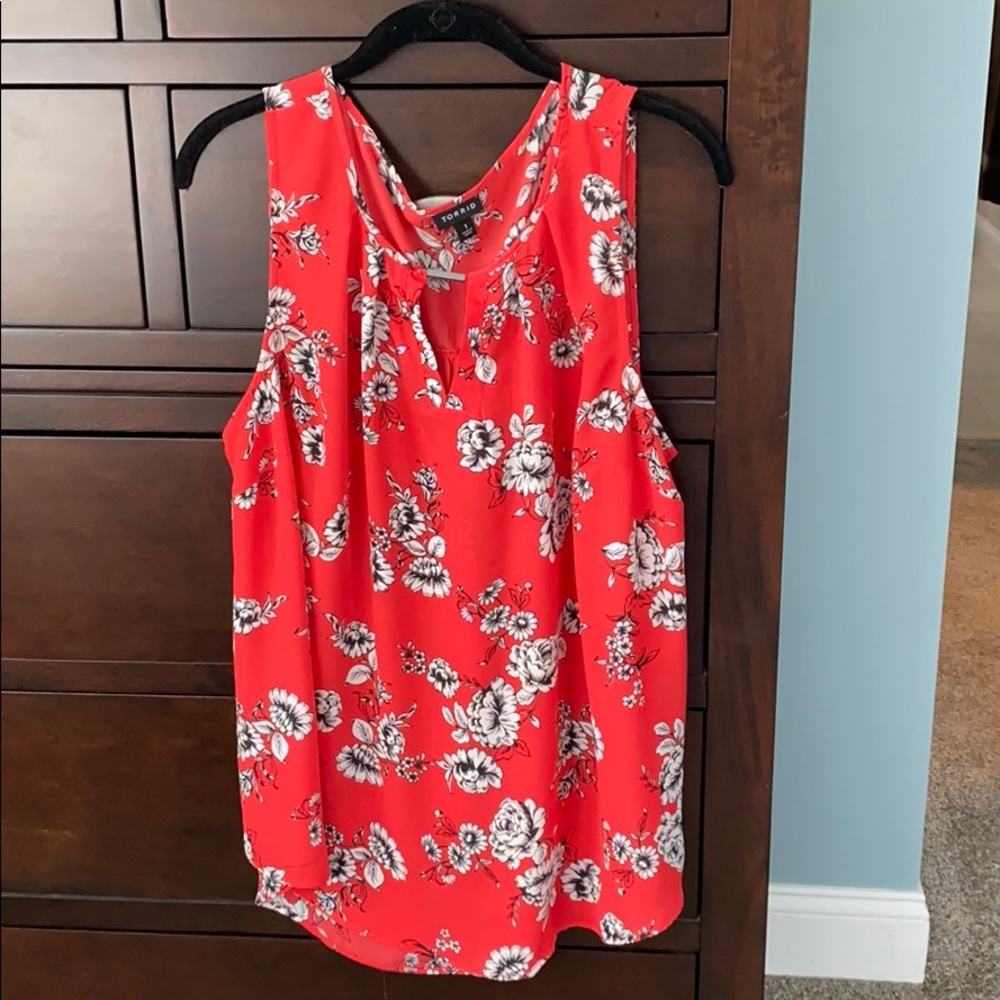 Coral color sleeveless blouse with b&w flowers